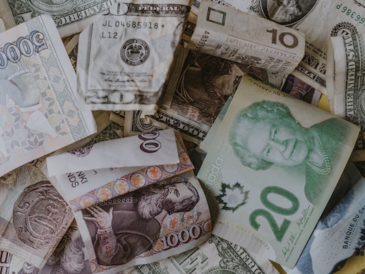 pile of scrambled dollar notes